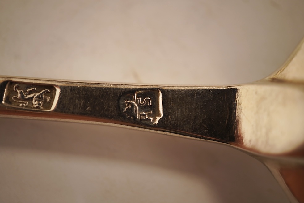 An 18th century Irish? provincial silver Hanoverian pattern tablespoon, maker's mark stamped twice 'I.T with crown above and mullet below' and 'Sterling', 20.9cm, together with eight assorted 18th century silver rat tail